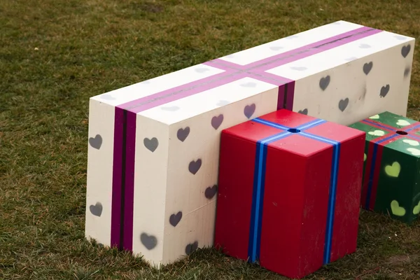 Gift boxes in the grass — Stock Photo, Image