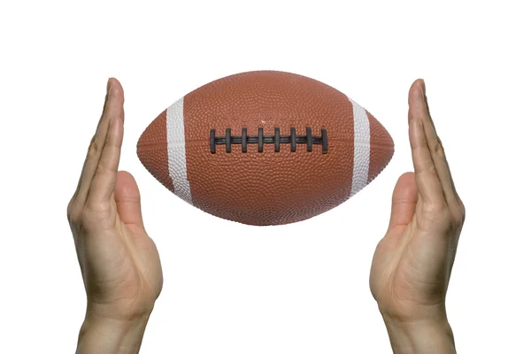 Football between two hands — Stock Photo, Image