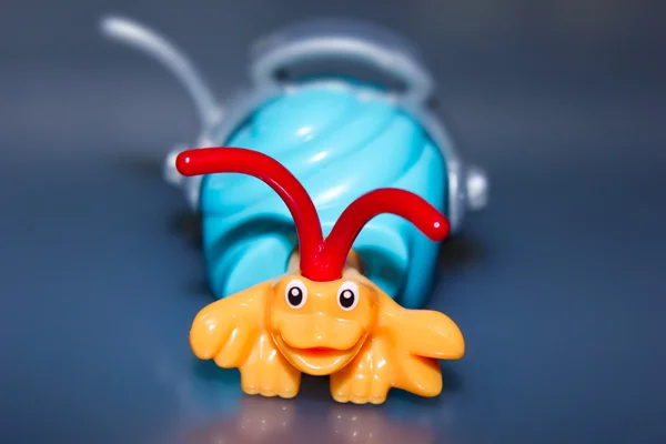 stock image Toy crab blue background