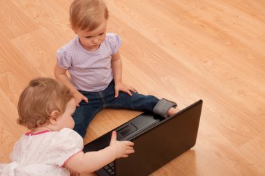 Toddlers studying laptop clipart