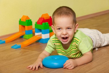 Shouting kid in the children room clipart