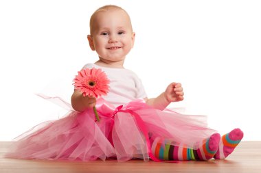 Little laughing girl with a flower clipart