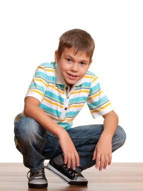 Smiling squating boy clipart