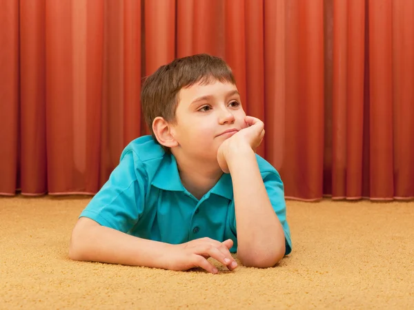 Dreaming boy on the floor — Stock Photo, Image