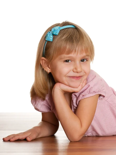 Cheerful girl on the wooden floor — Stock Photo, Image