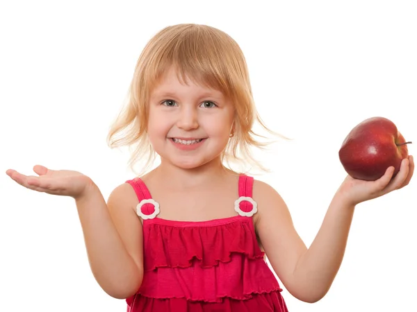 Маленька дівчинка в червоному з червоним яблуком — стокове фото