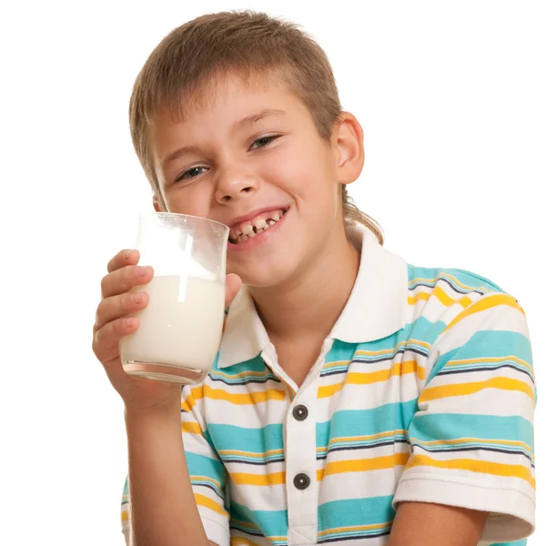 Handsome boy with a glass of milk — Stock Photo, Image