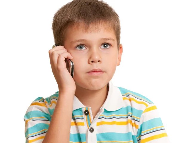 Um miúdo sério a falar ao telefone. — Fotografia de Stock