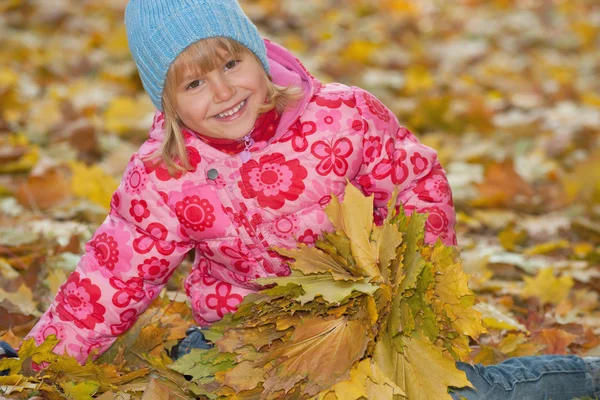 Happy girl with yellow leaves — Stock Photo, Image