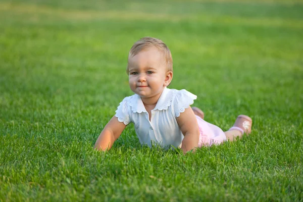 Plumpy baby on the meadow — Stock Photo, Image