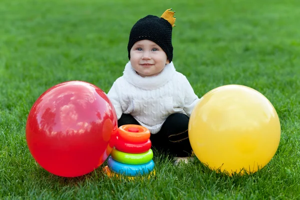 Kid with bright toys — Stock Photo, Image