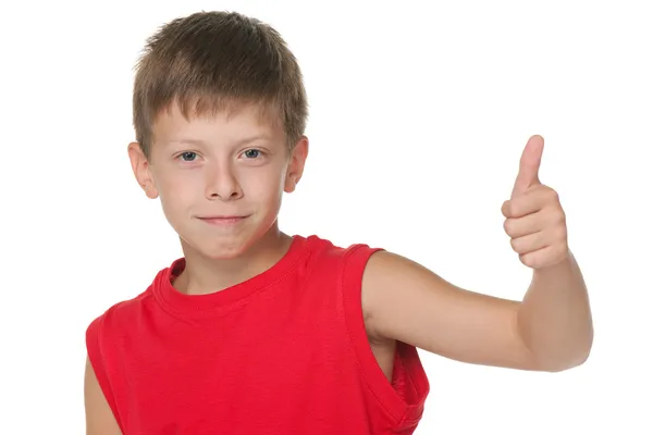Handsome boy demonstrates thumb up — Stock Photo, Image