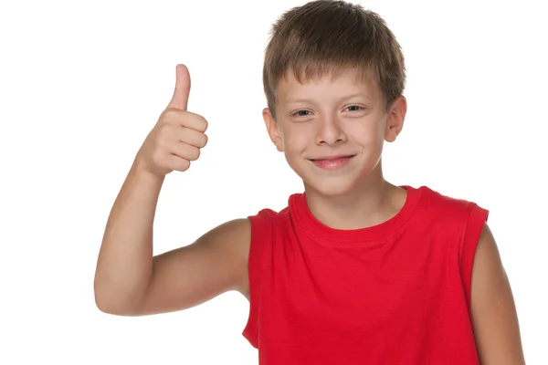 Smiling boy demonstrates thumb up — Stock Photo, Image