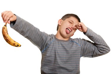 Dissatisfied kid holding an ugly banana clipart