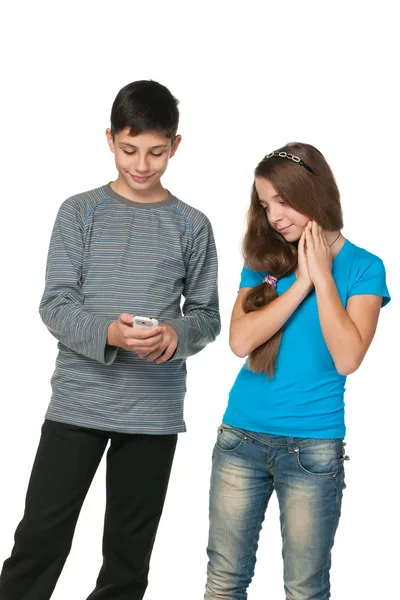 Fashion teenagers with a cell phone — Stock Photo, Image