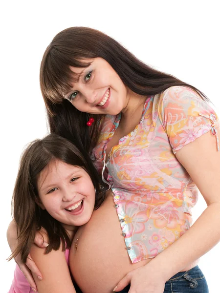 Gelukkig zwangere lady en haar oudste dochter — Stockfoto