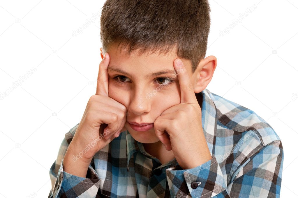 Thoughtful kid holding his head with his fingers