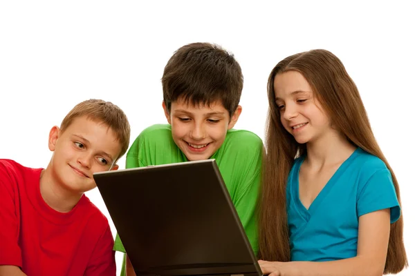 Happy kids playing with the laptop — Stock Photo, Image