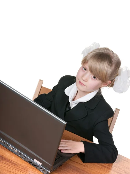 Pretty schoolgirl studying with laptop — Stock Photo, Image