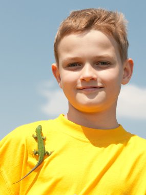 Smiling boy with lizard clipart