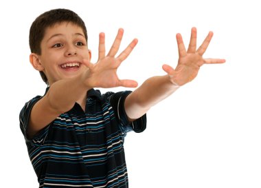 Spontaneous boy is stretching his hands towards an invisible aim clipart