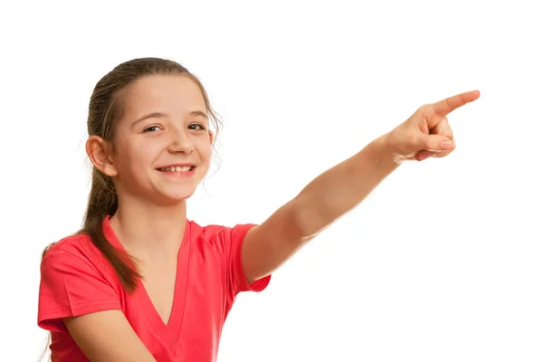 Smiling girl pointing forward — Stock Photo, Image