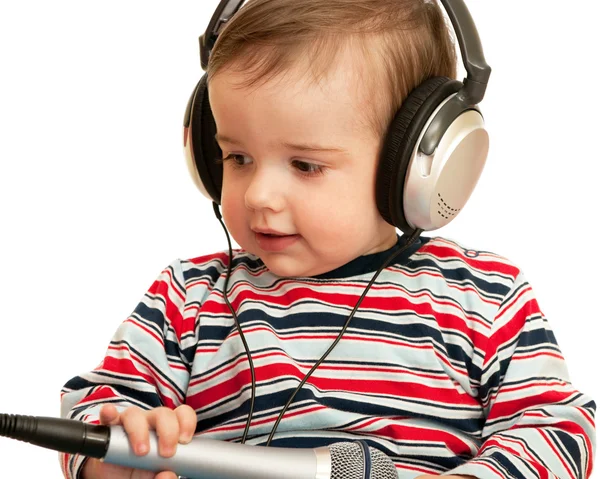 Dado un niño de habla con auriculares y micrófono — Foto de Stock