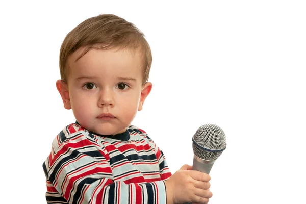 Στοχαστικό μικρό παιδί με μικρόφωνο — Φωτογραφία Αρχείου