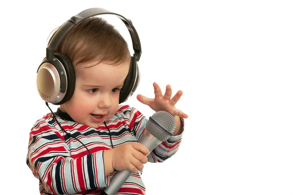 Speaking toddler with headphones and microphone — Stock Photo, Image