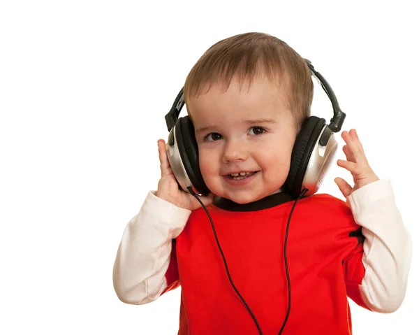 ヘッドフォンで幼児の笑みを浮かべてください。 — ストック写真