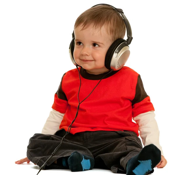 Uśmiechnięty chłopczyk ze słuchawkami — Zdjęcie stockowe