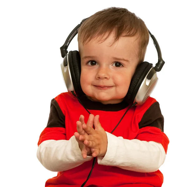 Uśmiechnięty chłopiec ze słuchawkami — Zdjęcie stockowe