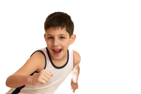 Skrattande pojke går i för friidrott — Stockfoto