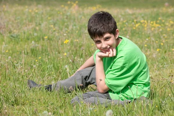 Handsome boy on the meadow — Stock Photo, Image