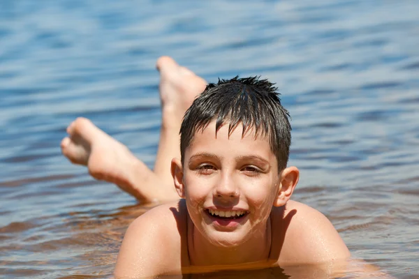 Happy boy in the sea — Stock Photo, Image