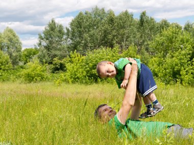 Happy father and his little son clipart