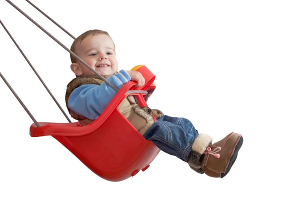 Bebê brincalhão em um balanço — Fotografia de Stock