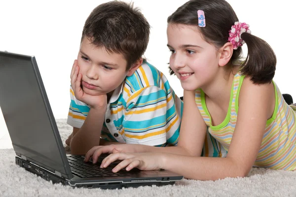 Children discovering laptop — Stock Photo, Image