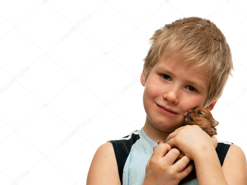 Portrait of a boy with a puppy