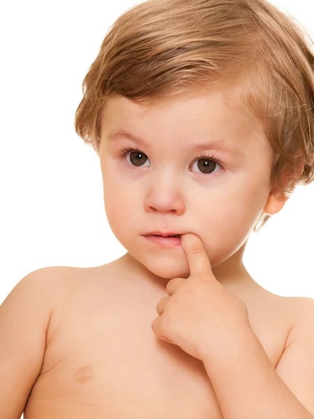 Retrato de uma criança pensativa com um dedo na boca — Fotografia de Stock