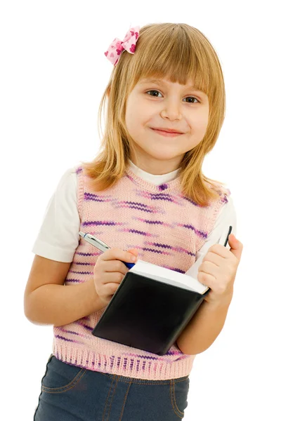 Kleines Mädchen mit Notizbuch — Stockfoto