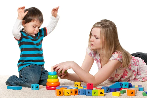 Playing on the carpet with blocks — Stock Photo, Image