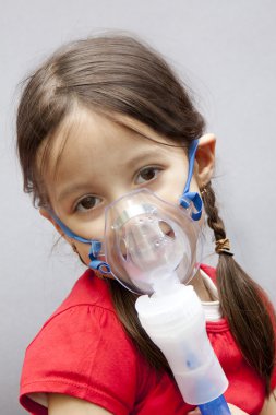 Little girl with nebulizer clipart