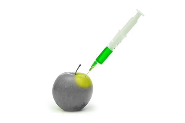 Genetic modification apple with syringe — Stock Photo, Image