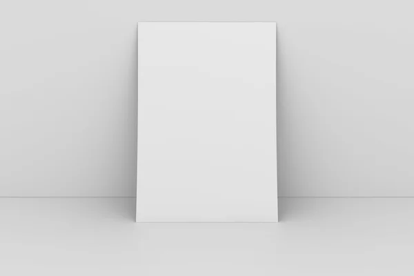 Papel em branco contra parede branca — Fotografia de Stock