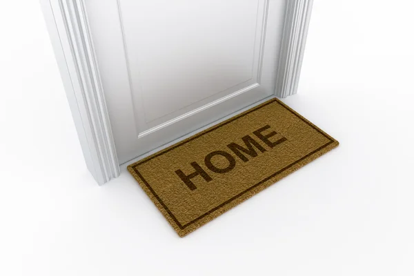 Дверь с "домашним" ковриком — стоковое фото