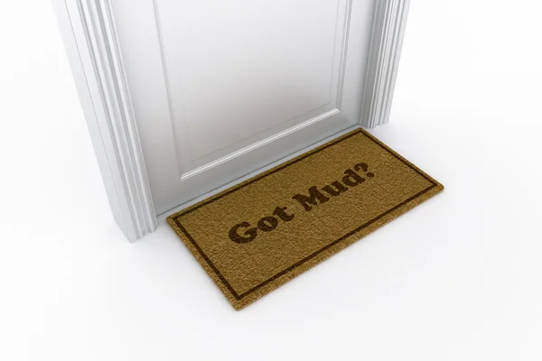 Door with "got mud?" doormat — Zdjęcie stockowe