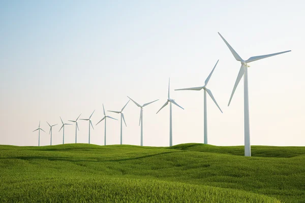 Wind turbines on green grass field — Stock Photo, Image