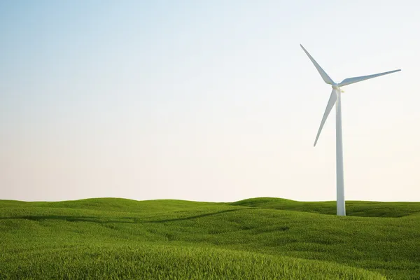 緑の芝生のフィールド上の風力タービン — ストック写真