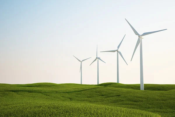 Turbinas eólicas en campo de hierba verde — Foto de Stock